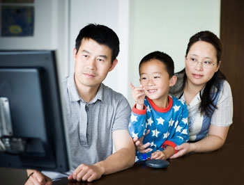 a young family viewing a website